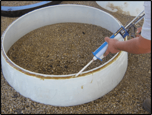 MwayPro Watertight Manhole Cover installation- applying product on edge
